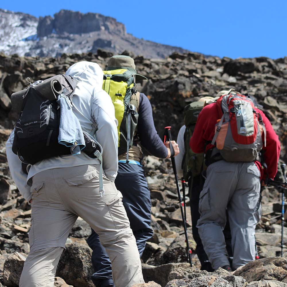 Hikers ascending Mount Kilimanjaro via the 6-Day Rongai Route toward Uhuru Peak