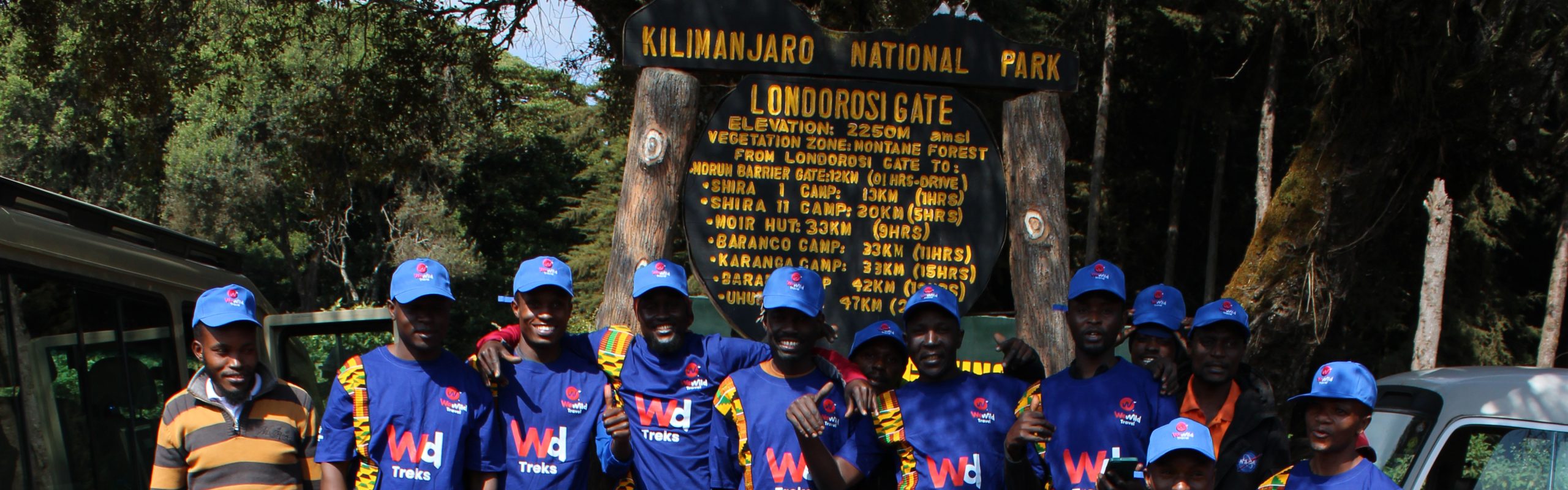 Hikers walking through beautiful mountain scenery along the 8-Day Lemosho Route on Kilimanjaro.
