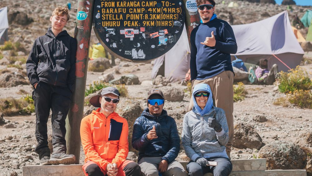 Hikers enjoying stunning mountain views while trekking the scenic 7-Day Lemosho Route on Kilimanjaro.