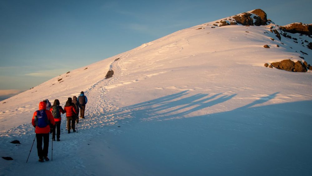 Mountain Kilimanjaro trekking guide 2026 showing hikers on scenic mountain trails and natural landscapes