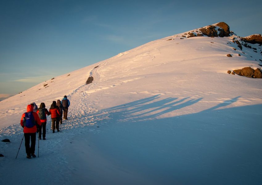 Mountain Kilimanjaro trekking guide 2026 showing hikers on scenic mountain trails and natural landscapes
