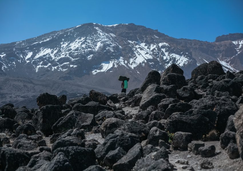 Is Climbing Kilimanjaro Worth It showing trekkers reaching summit of Mount Kilimanjaro Tanzania