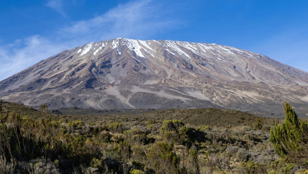 Mount Kilimanjaro volcanic cones showing Kibo Mawenzi and Shira eruption history landscape today