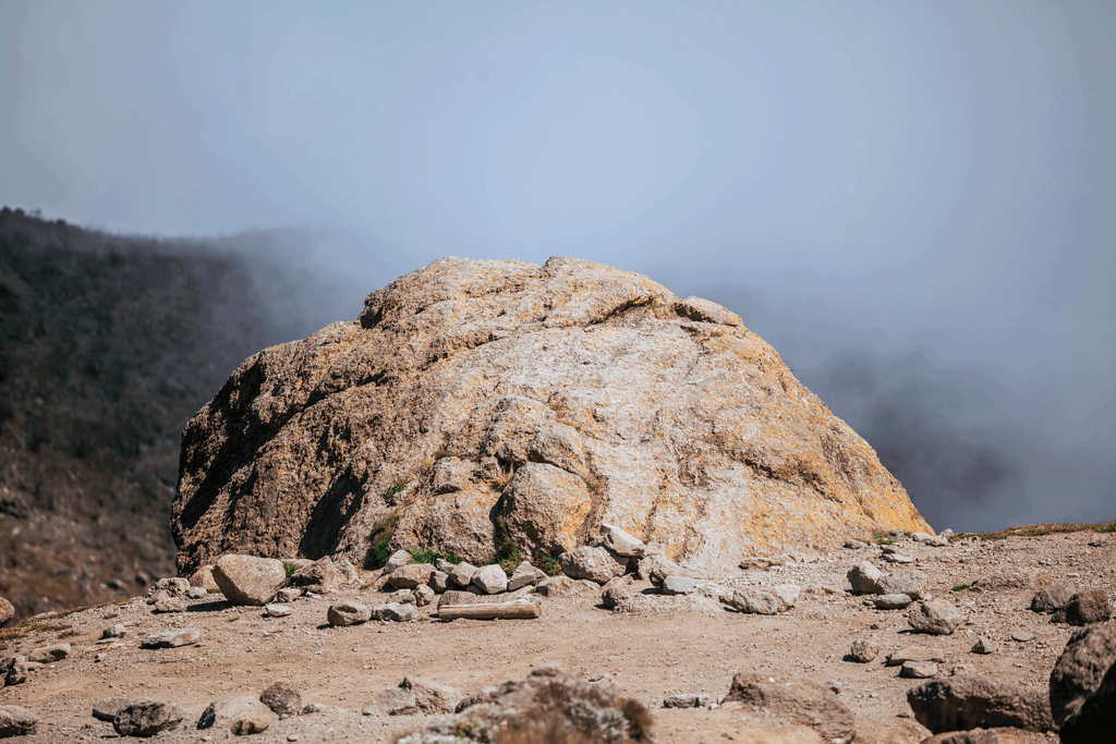 Kilimanjaro mountain stone marking the route toward Uhuru Peak