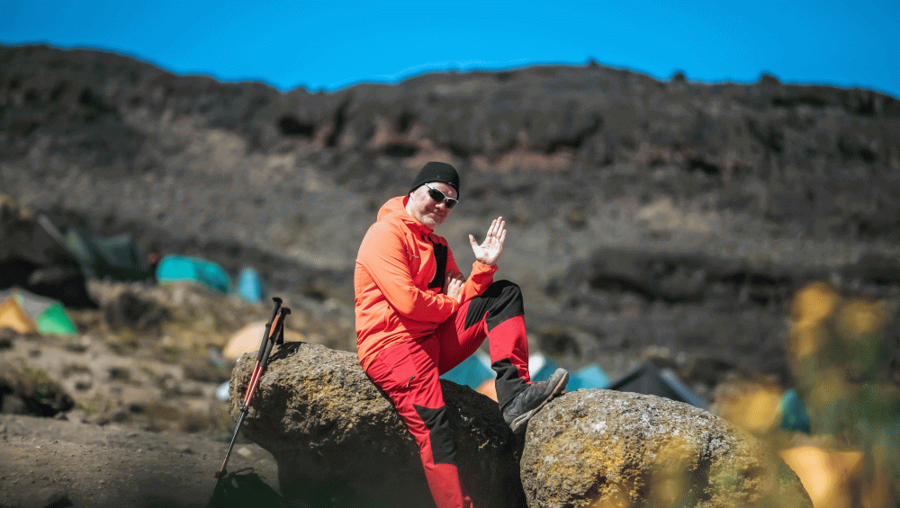 Machame Route visitor relaxing at a mountain camp during Kilimanjaro trek