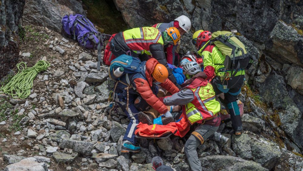 Climbers on Mount Kilimanjaro experiencing high altitude conditions and symptoms of altitude sickness
