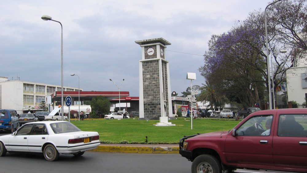 Arusha clock tower landmark showing city center atmosphere before climbing Mount Kilimanjaro adventure.