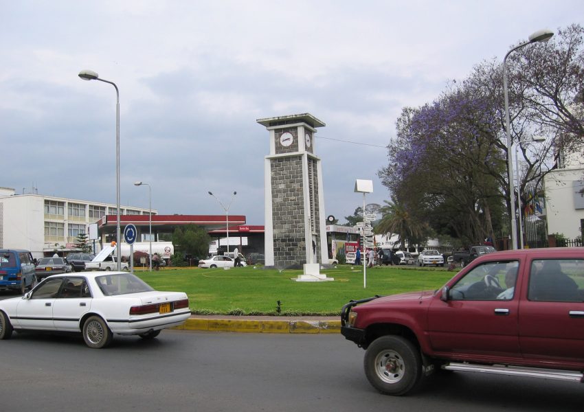 Arusha clock tower landmark showing city center atmosphere before climbing Mount Kilimanjaro adventure.