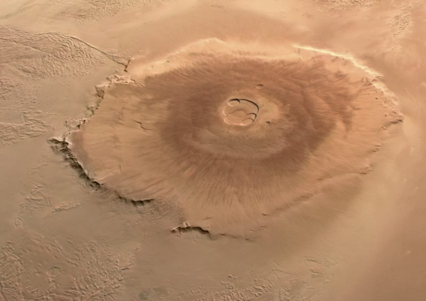 Illustration of Olympus Mons on Mars showing the tallest volcano in the Solar System with a vast volcanic landscape.
