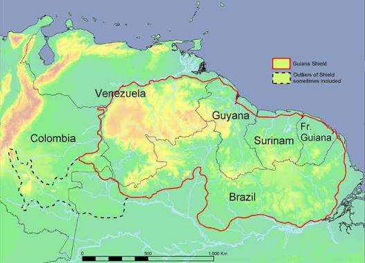 Guiana Shield region in northern South America featuring ancient rocky plateaus, tropical rainforest, and steep tepui mountains rising above dense jungle.