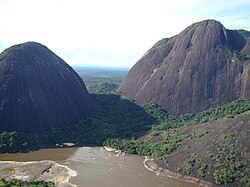 Guiana Shield in northern South America showing ancient plateau landscapes, dense rainforest, and flat-topped tepui mountains rising above the forest canopy.
