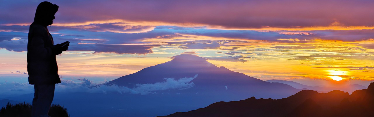 Hikers trekking through the scenic Machame Route toward Mount Kilimanjaro summit