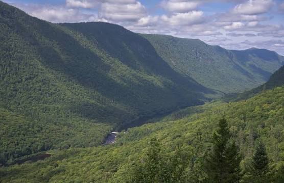 Laurentian Mountains in Quebec, Canada showing ancient rounded forested hills formed by billions of years of erosion.