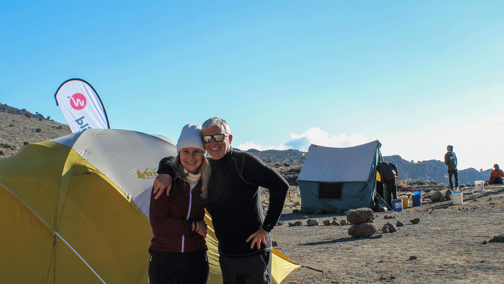Colorful tents at Machame Campsite beneath Mount Kilimanjaro on the Machame Route