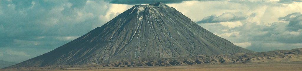 Ol Doinyo Lengai active volcano rising above the Great Rift Valley near Lake Natron in Tanzania.