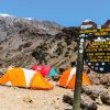 Barafu Camp sign standing among rocky terrain near the final summit route on Mount Kilimanjaro.