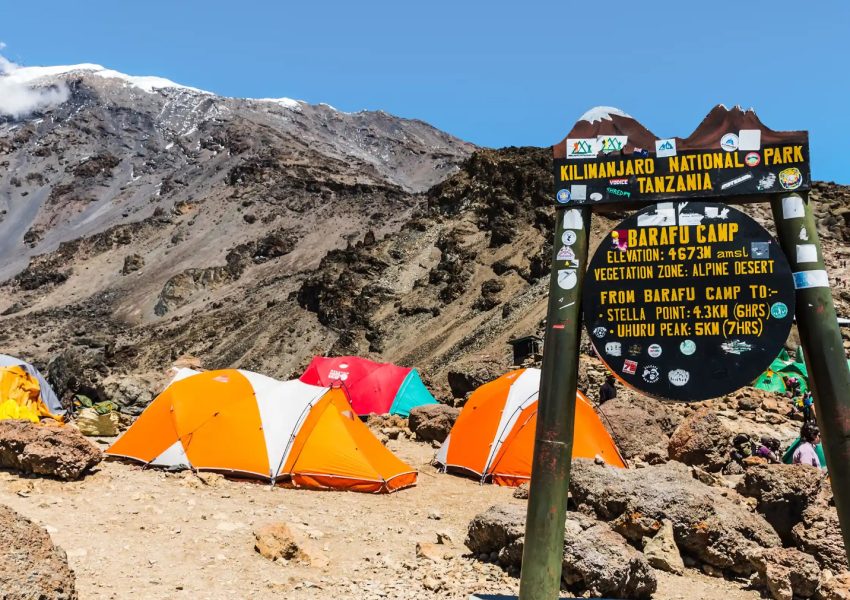 Barafu Camp sign standing among rocky terrain near the final summit route on Mount Kilimanjaro.