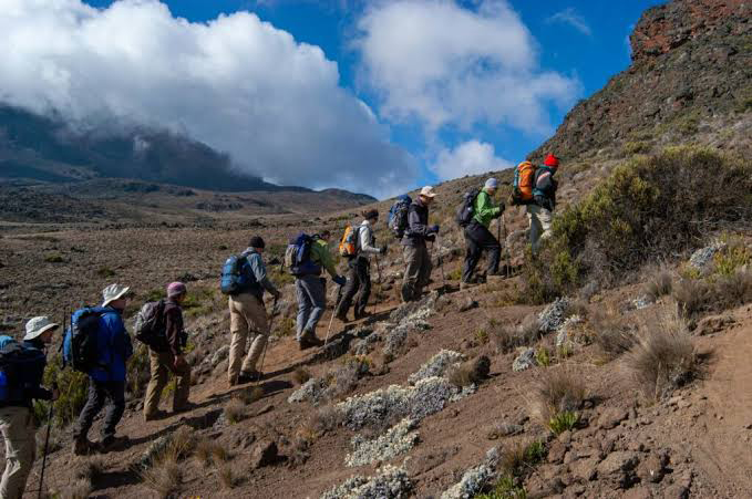 Climbers hiking toward Socialist Peak on Mount Meru in Tanzania.