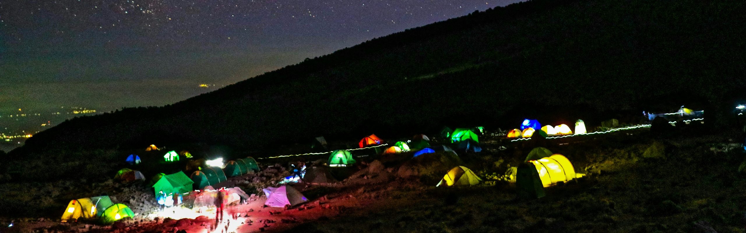 Northern Circuit campsite beneath a clear night sky filled with bright stars