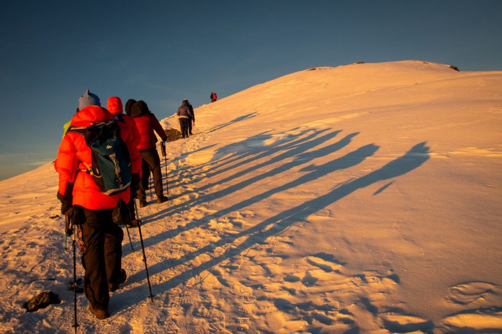 Snow-covered summit of Mount Kilimanjaro with icy glaciers and clear high-altitude mountain landscape.