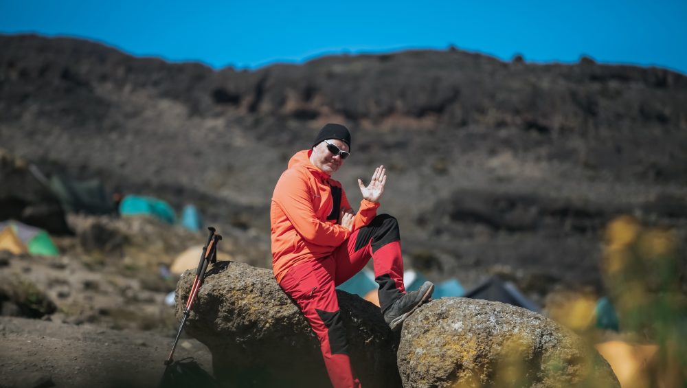 Kilimanjaro hiking packages with local guides trekking scenic trails through beautiful mountain landscapes in Tanzania