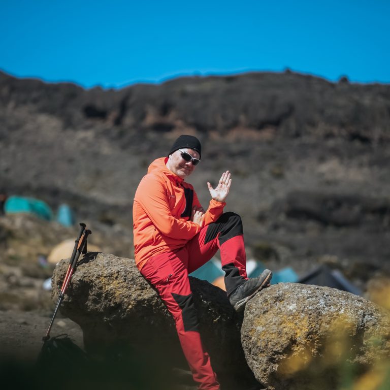 Kilimanjaro hiking packages with local guides trekking scenic trails through beautiful mountain landscapes in Tanzania