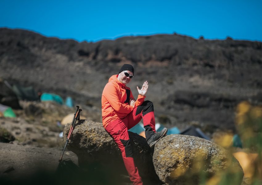 Kilimanjaro hiking packages with local guides trekking scenic trails through beautiful mountain landscapes in Tanzania