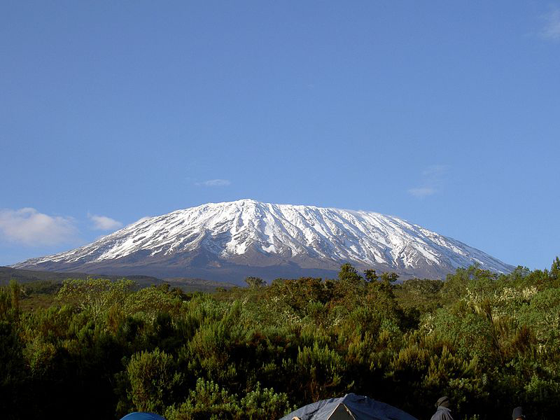 Mount Kilimanjaro landscape in Tanzania viewed by travellers preparing for a mountain climbing adventure
