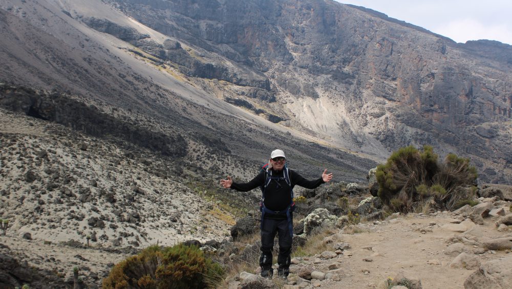 Singapore traveler preparing for a Kilimanjaro climb in Tanzania with mountain gear