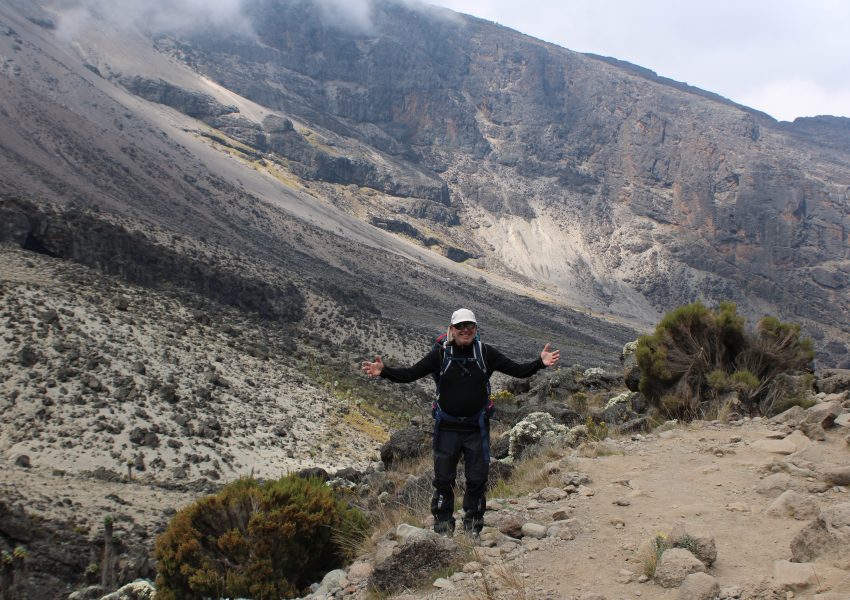 Singapore traveler preparing for a Kilimanjaro climb in Tanzania with mountain gear