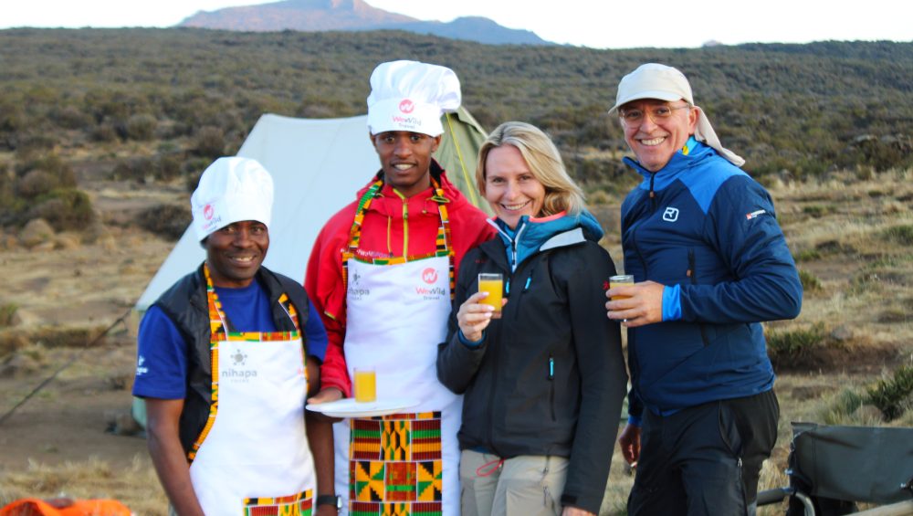 Client arrives at Kilimanjaro Shira Camp and enjoys fresh juice from the mountain crew.