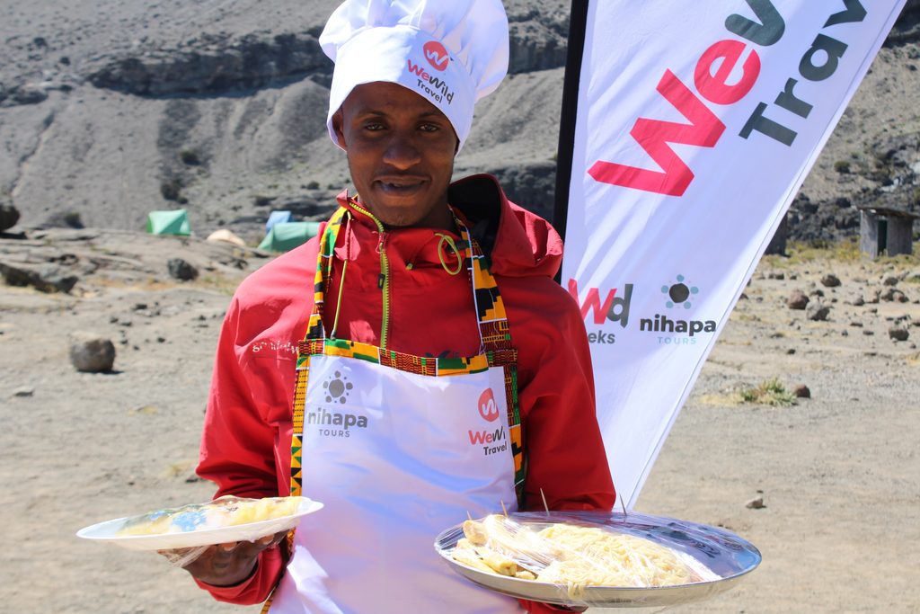 Fresh trekking meals prepared for climbers during a Kilimanjaro mountain expedition in Tanzania.
