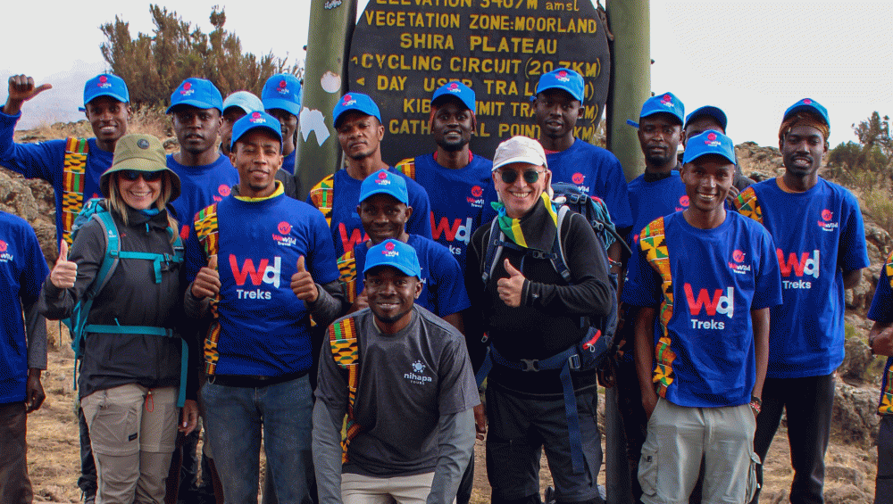 WeWild Travel Kilimanjaro guides and porters supporting climbers on the mountain