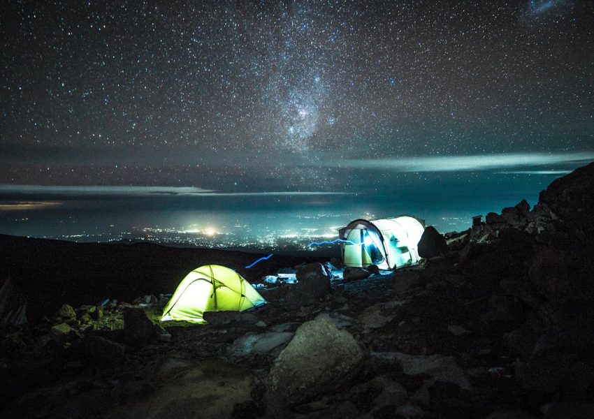 Full moon shining over Mount Kilimanjaro during a clear night summit climb in Tanzania