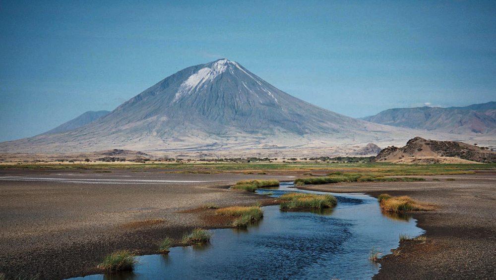 Ol Doinyo Lengai, Tanzania’s sacred Mountain of God rising above the surrounding landscape.